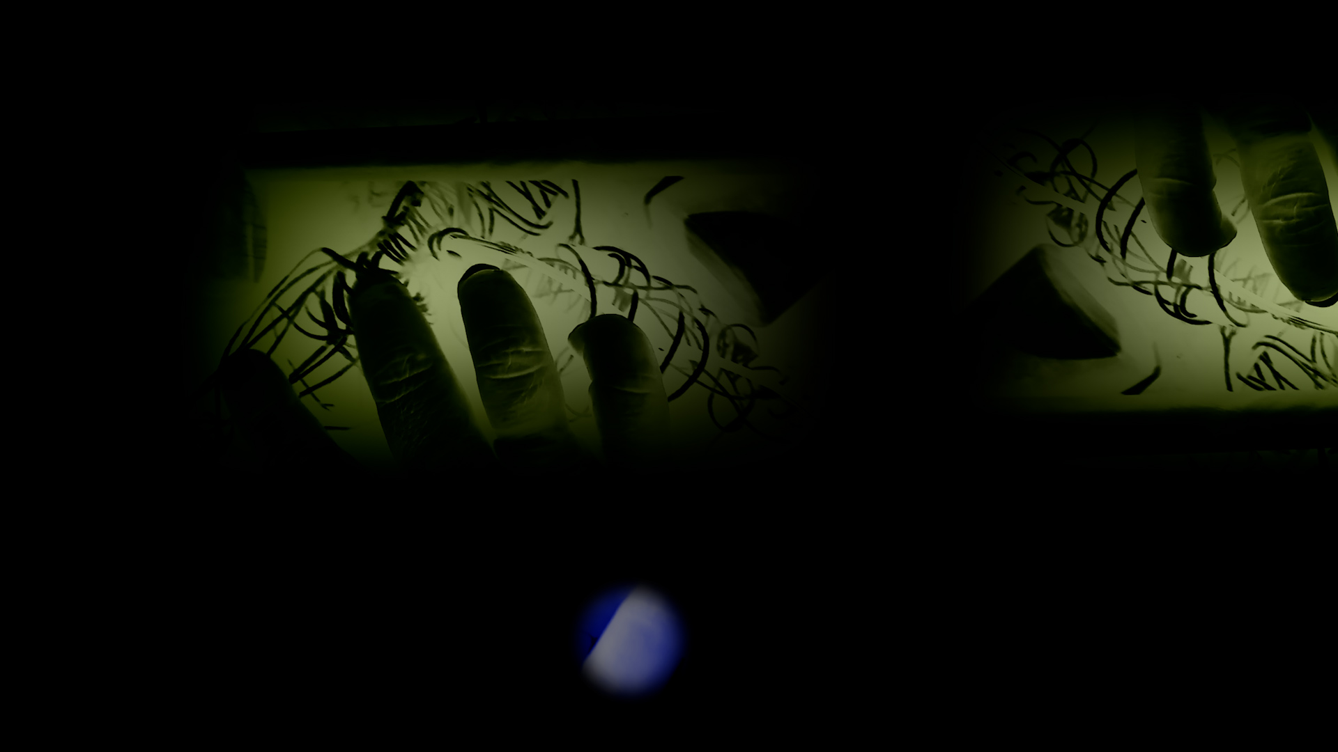 Hand and glasses — still from Catalytic Trifles